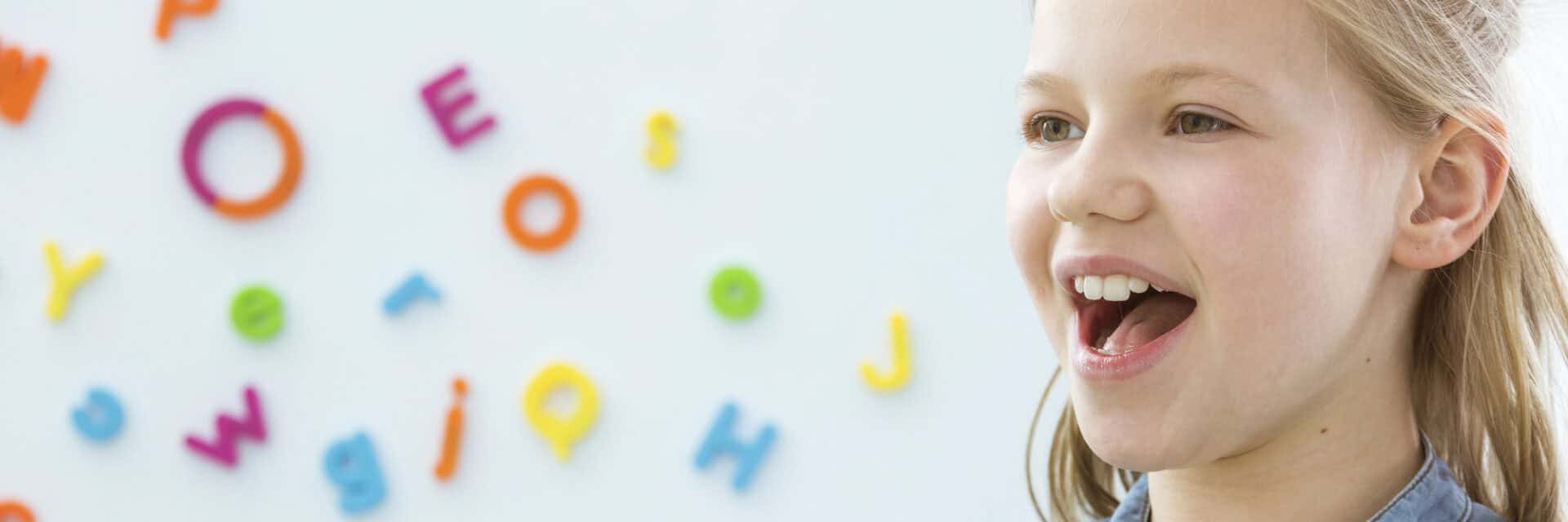 child making sounds for letters