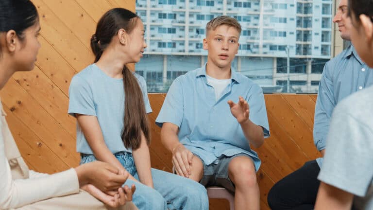 group of teenagers working on comunication skills