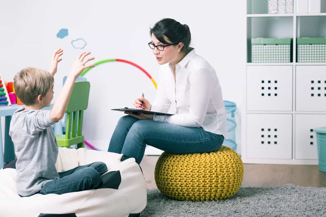 speech therapist with child during lesson