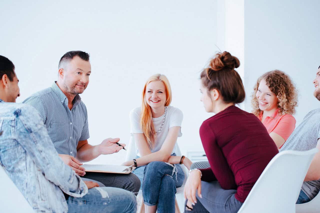group of teenagers during therapy with professional therapist